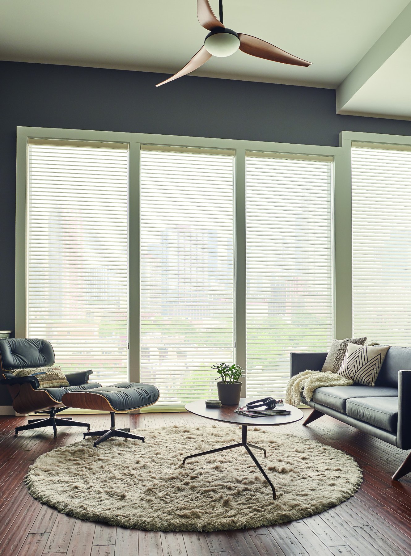 Tall sheer blinds in a designer living space