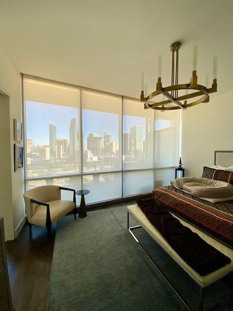Bedroom roller shades with city view