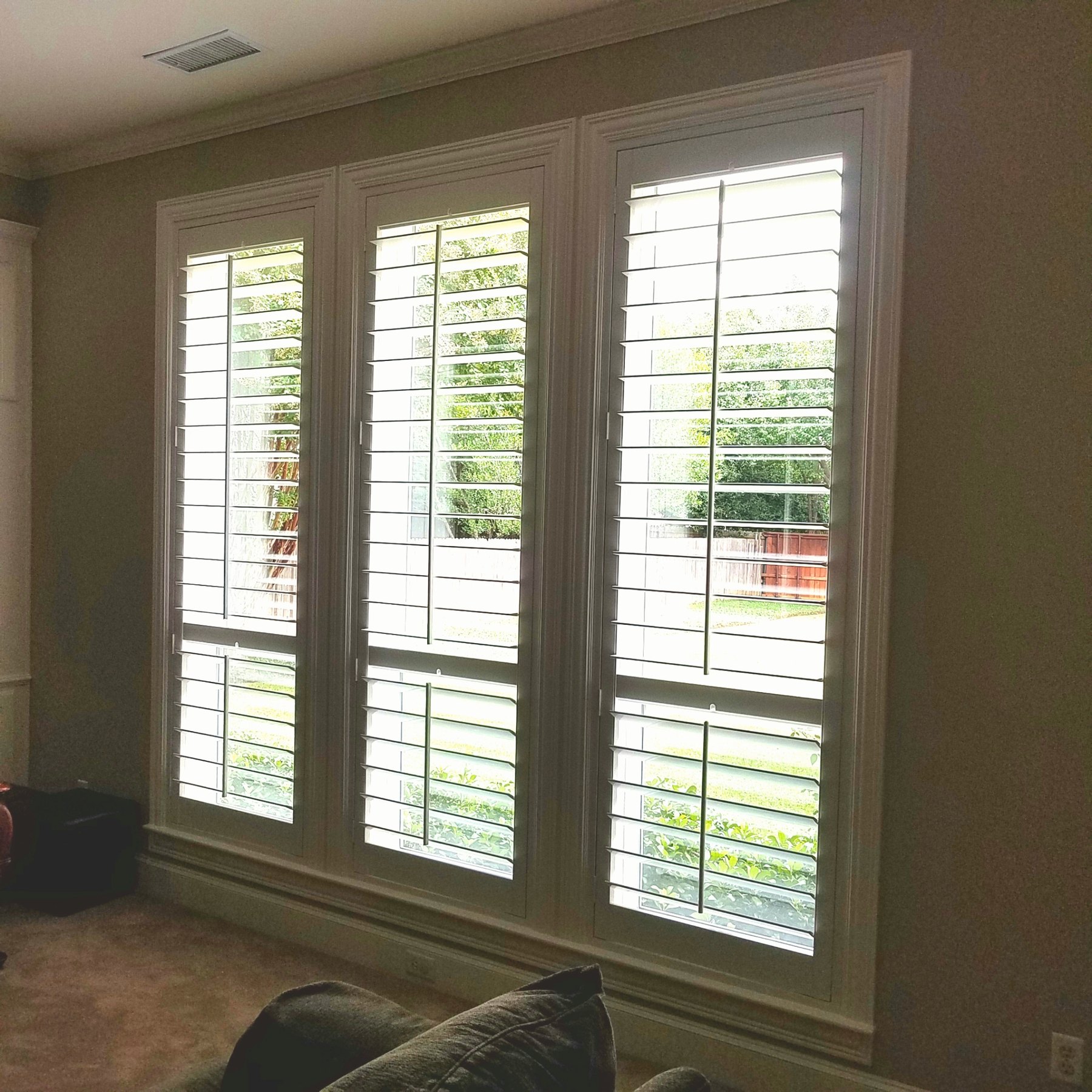 Large custom shutter wall with divider rail